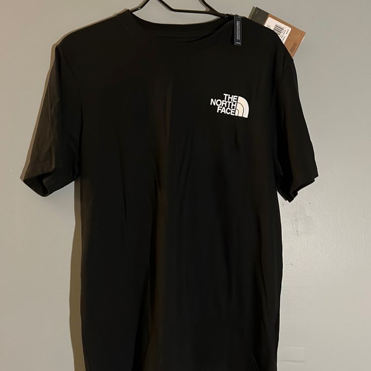 Never Been Worn Men’s North Face M T-Shirt The North Face Cotton Short Sleeve T-shirt, The North Face Cotton Crew Neck T-shirt, Black The North Face Crew Neck T-shirt, The North Face Black Crew Neck T-shirt, The North Face Black Casual T-shirt, The North Face Letter Print Streetwear Tops, The North Face Crew Neck Top With Letter Print, Casual The North Face Crew Neck Tops, Casual Black The North Face T-shirt