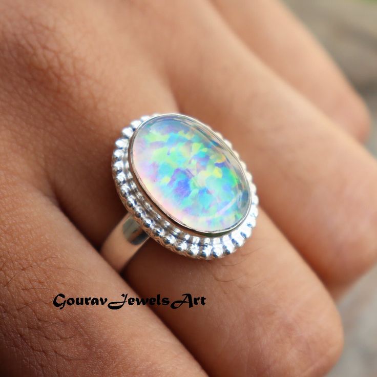 Ethiopian Opal Opal Ring, Amazing Ring, Statement Ring, Adjustable Ring, 925 Silver Ring, October Birthstone, Popular Ring, Wedding Ring Description Metal :- 925 Sterling Silver Style : Band Ring Gemstone:- Monarch Opal Benefits Of Monarch Opal Encourages both freedom and independence. Opal enhances cosmic consciousness and induces psychic and mystical visions. It stimulates originality and creativity. Helps to release anger and claim self worth, aiding in accessing and expressing one's true self. Occasion : Birthday Events, Lovely Valentine's Day Gift, Anniversary Gift, Weeding Gift, Engagement Ring, Lover Gift Ring, Hen Party And Other Occasion.... Your order will be handmade and ready for shipment in 1 to 1 business days Normally we ship via UPS it takes 3 to 4 weeks if you need faster Iridescent Opal Ring In Sterling Silver For Anniversary, Silver Multi-stone Opal Ring For Promise, Sterling Silver Opal Ring With Center Stone For Anniversary, Anniversary Silver Opal Ring, Anniversary Opal Rings Stamped 925, Silver Opal Crystal Ring For Anniversary, Silver Opal Ring With Stone Setting For Anniversary, Hallmarked Opal Anniversary Ring, Silver Opal Gemstone Ring