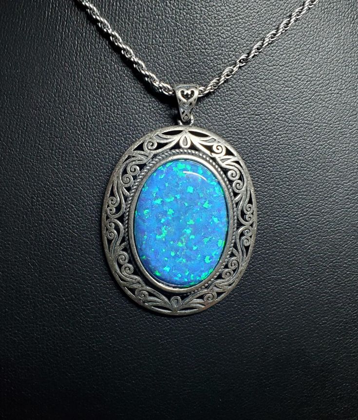 Huge Beautiful Blue Opal Necklace, 18x25mm Lab Created Blue Opal With Green And Lavender Fire, See Video! 925 Sterling Silver Vintage Style, Bezel Setting, Antique Finish Sterling With Sterling Chain. Gift Box Included. Blue Round Large Pendant Jewelry, Blue Large Round Pendant Jewelry, Blue Jewelry With Large Oval Pendant, Blue Jewelry With Large Pendant For Formal Occasions, Formal Blue Jewelry With Large Pendant, Formal Blue Oval Pendant Necklace, Formal Blue Cabochon Necklace, Blue Oval Cabochon Necklace, Blue Oval Cabochon Jewelry