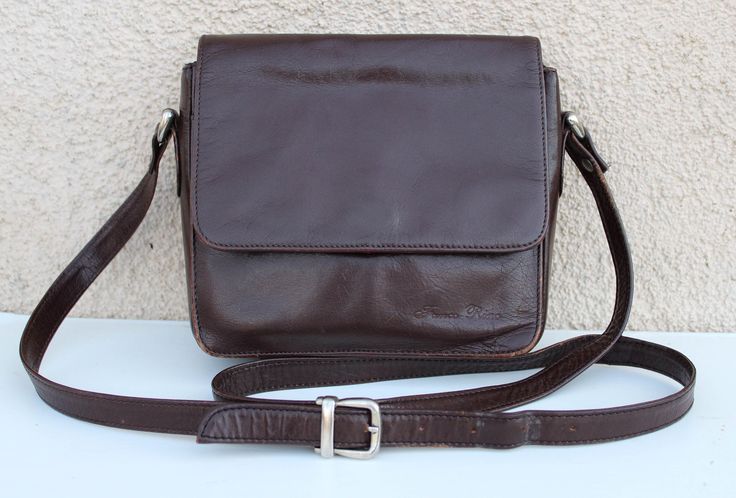 "Vintage 80's Shoulder Bag women's / brown Saddle Bag / Cross Body Purse  / Hippie Boho Artisan 70s Bag MEASUREMENTS: Height (top to bottom): 6.5\" / 16.5 cm cm Width (front side to side) : 7.5\" / 19.1 cm Deep: 4\" / 10.1 cm Strap: 52\" / 132 cm Condition: great vintage  N.B. Color may slightly differ from picture. SHIPPING * I ship worldwide via Priority mail (Latvijas Pasts) from Latvia (EU). * I ship from Europe, so please allow 2 to 4 weeks for the package to arrive if you live overseas. * Retro Brown Saddle Bag For Daily Use, Retro Brown Saddle Shoulder Bag, Retro Brown Satchel Saddle Bag, Retro Brown Saddle Bag Satchel, Retro Brown Saddle Satchel Bag, Retro Brown Saddle Bag For Everyday, Retro Brown Shoulder Bag For Business, Vintage Brown Saddle Bag For Business, Vintage Brown Rectangular Saddle Bag