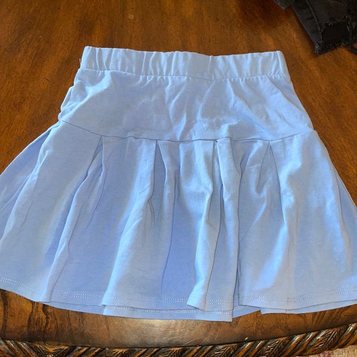 Never Worn Before! Super Stretchy And Good Quality Blue Stretch Tennis Skirt With Elastic Waistband, Casual Blue Tennis Skirt With Elastic Waistband, Blue Stretch Tiered Mini Skirt, Light Blue Lined Casual Skirt, Light Blue Flared Casual Skirt, Casual Light Blue Flared Skirt, Light Blue Casual Flared Skirt, Light Blue Stretch Skort, Casual Style, Light Blue Stretch Skort For Casual Wear