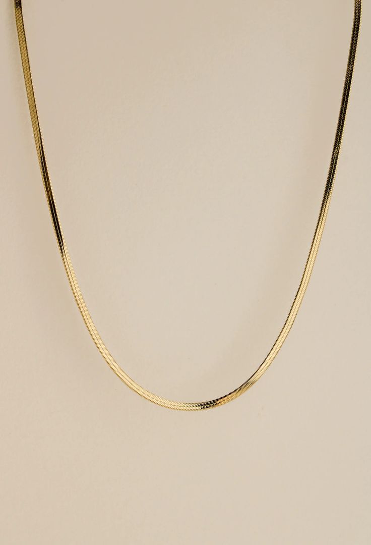 The herringbone chain style is an intricate tapestry of links, laid parallel to each other. It is a classic chain style tracing its origins to Ancient Egypt, and is named for its resemblance to the many slanted bones of the herring fish. The chain lies flat against the skin, gracefully contouring the wearer's neck.  Th Classic Gold Herringbone Necklace With Snake Chain, Classic Herringbone Link Necklace, Herring Fish, Herringbone Chain Necklace, Herringbone Chain, Detail Shop, Ancient Egypt, Chain Styles, Jewelry Care