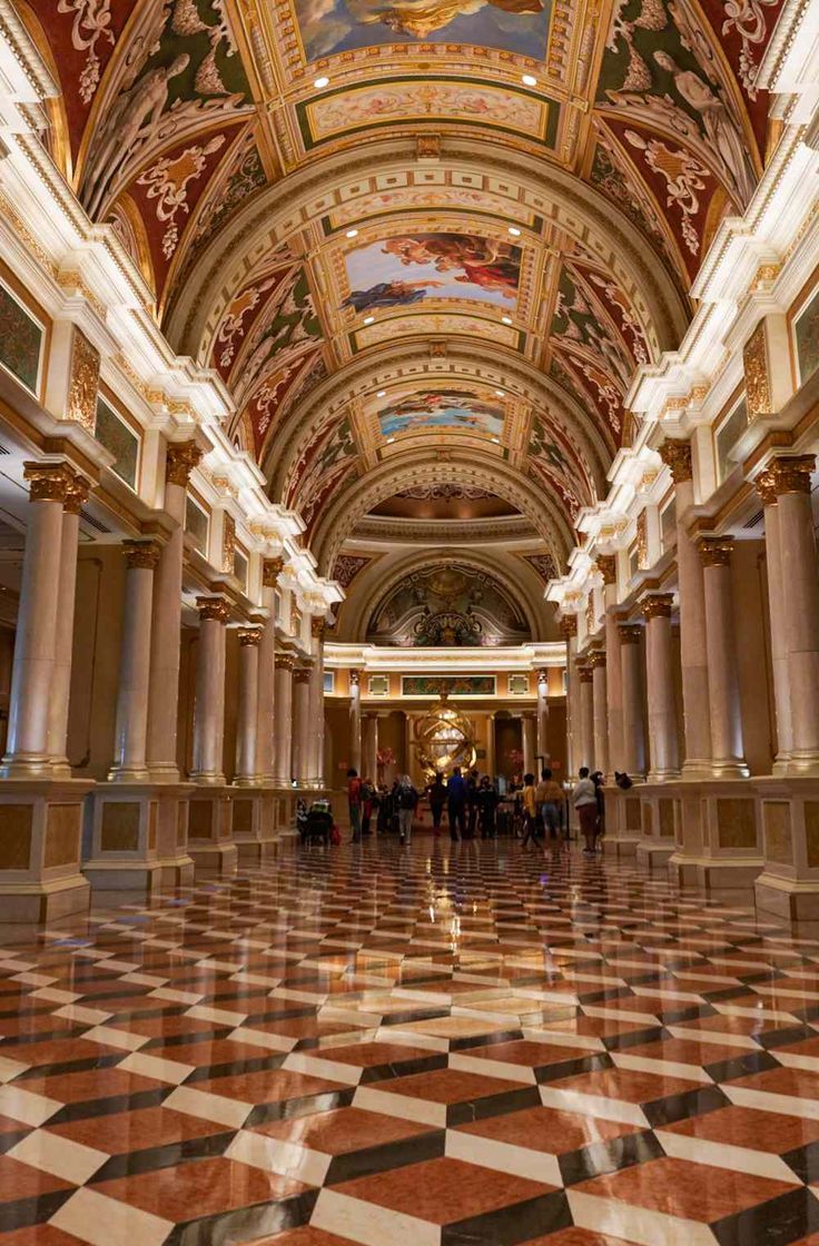 the inside of an ornate building with marble floors