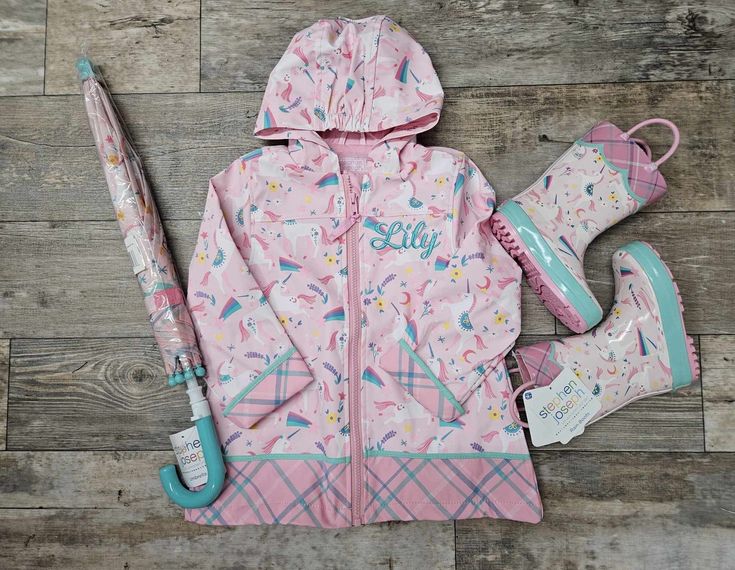 "Personalized Girls Rain Coat Set - Pink Unicorn Includes Rain Coat with Personalization, Rain Boots and Umbrella IF ONLY ORDERING 1 ITEM SELECT THE SIZE IN THE SIZE DROP DOWN GROUP IF ORDERING MULTIS SELECT MULTI LEAVE NOTE AND PUT IN THE NOTES AT CHECKOUT THE SIZES YOU NEED.  I WILL LET YOU KNOW IF ALL THREE ARE AVAILABLE. When it rains, it pours. But don't let that stop the family fun; get your little ones ready for the weather with Stephen Joseph Rain Coats. Each design is so colorful and fu Fun Multicolor Hooded Outerwear, Fun Pink Outerwear For Winter, Fun Pink Winter Outerwear, Fun Winter Outerwear For Playtime, Multicolor Fall Outerwear For Playtime, Playful Winter Raincoat, Hooded Fall Raincoat For Playtime, Hooded Raincoat For Spring Playtime, Fun Pink Spring Outerwear