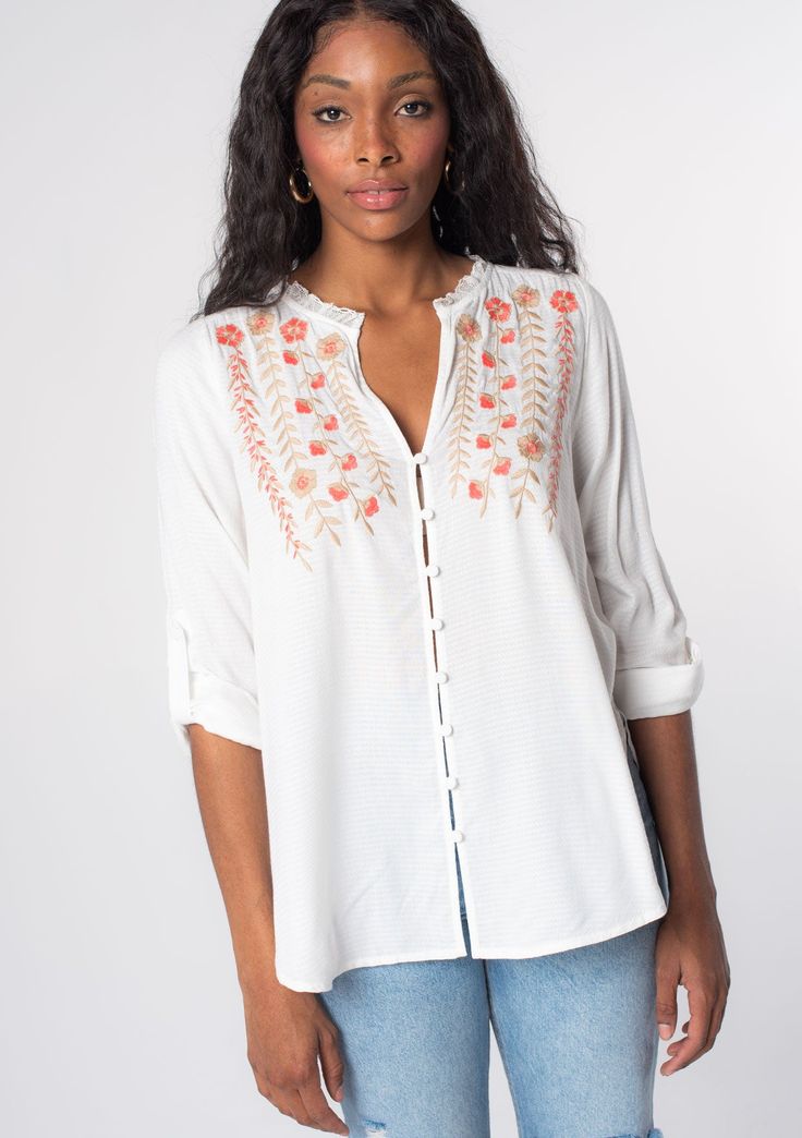 Looking for a Spring wardrobe refresh? This simple yet refined long sleeve bohemian blouse features a delicate self-covered button front, flattering split v-neckline, and floral embroidered detail. Wear it loose over denim, or try it tied in the front. Vintage floral embroidery Relaxed fit Long rolled sleeve with button tab closure Rounded hemline Side vents V-neckline Lace trim Self-covered button front Can be tied at the front Bohemian top Model is 5'9, wearing a size S.Style: I-13797W-RPX Long Sleeve Embroidered Top For Spring Daywear, Fall Floral Embroidered Button-up Blouse, Spring Embroidered Rayon Blouse, Fall Floral Embroidery Button-up Blouse, Bohemian Rayon Blouse For Daywear, Floral Embroidered V-neck Peasant Top For Spring, Spring Floral Embroidered Rayon Blouse, Bohemian Long Sleeve Embroidered Top For Daywear, Spring Rayon Blouse With Floral Embroidery