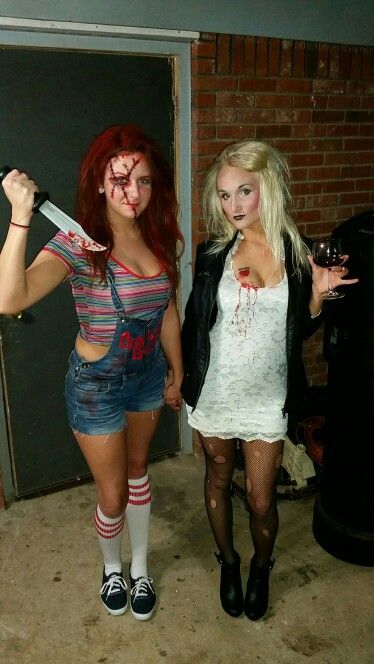 two women dressed up as zombies holding knives