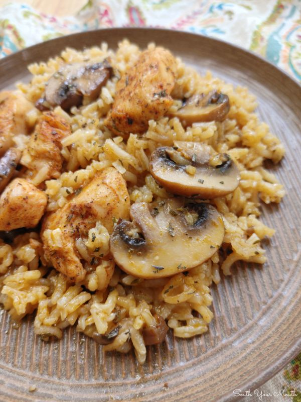 a plate with rice and mushrooms on it