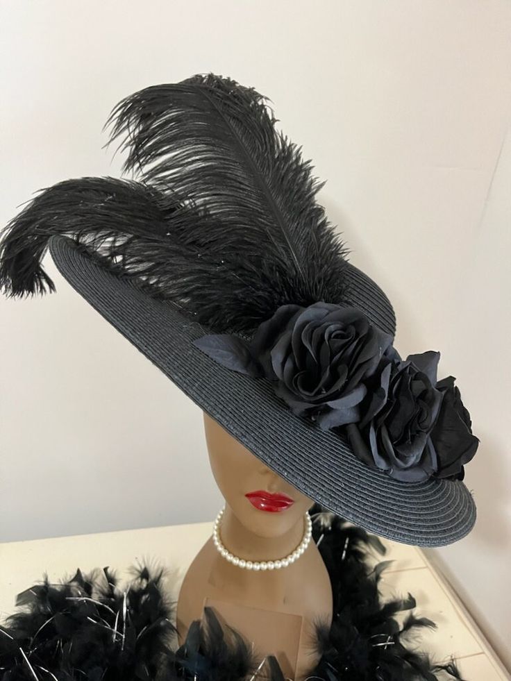 Ready to ship today from Tennessee, USA. I ship quickly and package safely in boxes. See more unique and distinctive choices at my Etsy Shop: https://www.etsy.com/shop/equineelan    This is a high quality wide brim woven sun hat with black roses and large black ostrich plumes. Very Victorian or Gothic. Perfect for so many occasions.  Very formal and depending what you pair it with can be worn for funerals or parties.  Wear the brim straight or bend it over one eye. Wear the hat flat on your head Dress Hat, Black Kentucky Derby Hat, Black Rose Outfit, Big Hats For Women, Gothic Hats, Wide Brim Hats, Derby Hats Women, Big Hats, Vintage Hats For Women