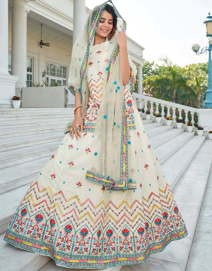 luxury Women White colored Salwar Kameez in Lehenga Style made with Net top and Chinon Chiffon Bottom fabric Processing Time : 8-10 Business Days Work : Embroidery, Gota Patti, Sequins & Lace Work Fabric: Top : Semi-Stitched Lehenga Choli Bottom : Chinon Chiffon Dupatta : Net #ladiessalwarkameez #salbar #salwaarsuitonlineshopping #salwarkameezforwomens #shalwarkameezladies #salwaarsuitsonlineshopping #ladiesshalwarkameez #churidarsalwars #salwarkameezwomen #shalwarkameezforwomen Luxury Chikankari Salwar Kameez For Navratri, Luxury Semi-stitched Net Salwar Kameez, Chiffon Lehenga, A Line Lehenga, White Lehenga, Stitched Lehenga, Net Blouses, Net Top, Lehenga Style