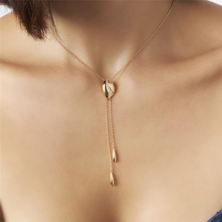 Introducing our 18K Gold-Plated Tie Necklace with Zirconias — a statement of refined elegance and timeless glamour. Versatile and chic, this piece effortlessly elevates any ensemble, making it the perfect accessory for both casual and formal occasions. 15.75in + 2in extender 40CM + 5CM Luxury White Lariat Necklace For Gift, Gold-tone Clavicle Chain Jewelry For Wedding, Elegant Formal Chain Necklace With Adjustable Chain, Modern Gold Plated Necklaces, Modern Gold-plated Necklaces, Elegant Chain Necklace As Gift, Formal Long Necklace With Clavicle Chain, Elegant Plated Chain Necklace Gift, Elegant Gold Plated Chain Necklace With Adjustable Chain