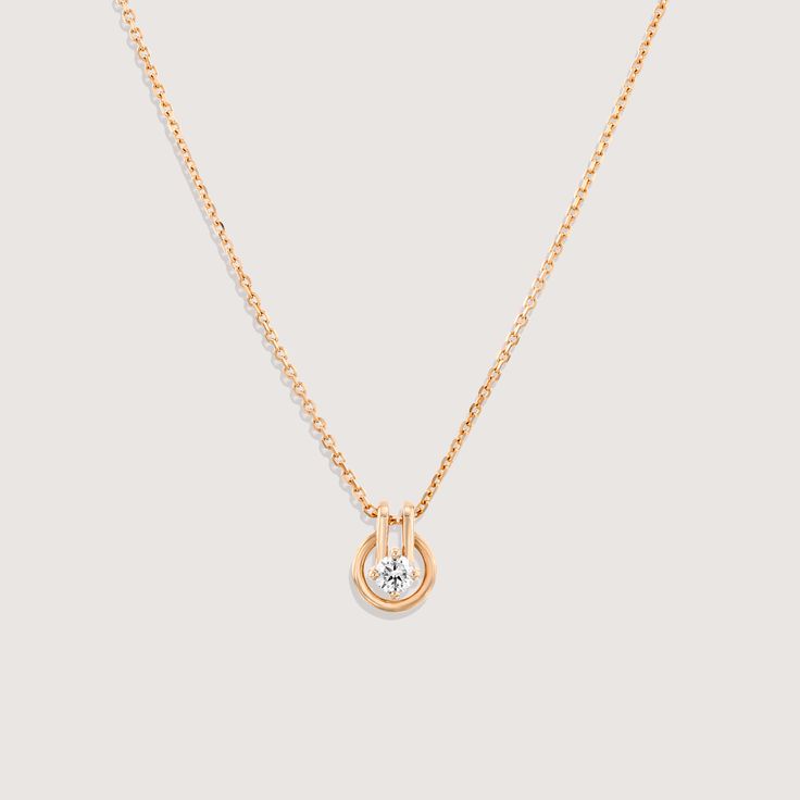 A fine chain leads to a circular gold pendant, with a diamond at the center. Inspired by the gold buttons that decorated suits in the 80s and 90s, we wanted to bring this moment back through one of our necklaces. Although overlooked often, buttons have played an integral role in fashion, whether advancing in practicality or as ornate details. We made sure that this piece was able to move along the chain like buttons do up and set free. If ordered in rose gold, the chain will be our Rollo chain. Timeless Solitaire Pendant Necklace For Formal Occasions, Timeless Solitaire Pendant Necklace For Formal Events, Formal Diamond Necklace With Detachable Round Pendant, Classic Chain Necklace With Pendant For Formal Occasions, Timeless Diamond Pendant Necklace, Timeless Diamond Necklace With Round Pendant For Formal Occasions, Dainty Pendant Chain Necklace For Formal Occasions, Timeless Round Pendant Diamond Necklace For Formal Occasions, Dainty Formal Pendant Chain Necklace