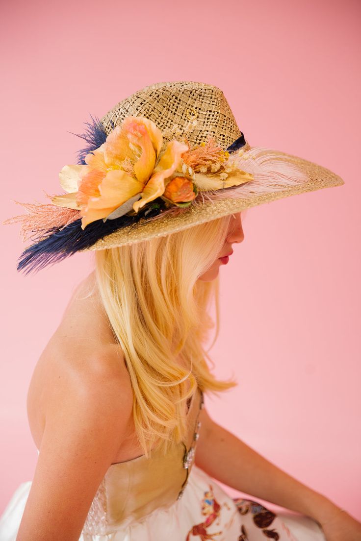 Stay ahead of the pack with THE FRONT RUNNER SUN HAT! The derby style will make you feel like a real winner while the navy feather and orange flower add a pop of color. Keep cool and fashionable with this must-have accessory. This hat is ONE OF A KIND, created by our owner Stephanie. To receive item quicker, expedited shipping is available at checkout. Derby Day, Front Runner, Orange Flower, Keep Cool, The Navy, The Pack, Orange Flowers, Sun Hat, Sequin Dress