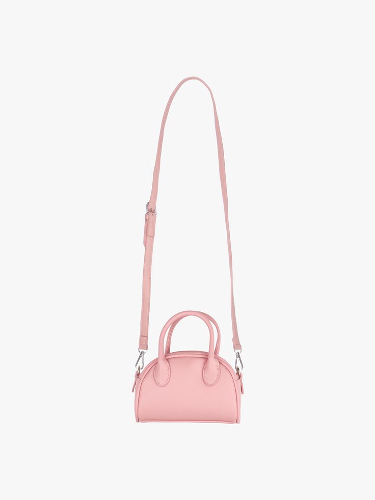 Editor's NotePINK PINEAPPLE is a brand that embodies the kitsch & lovely mood with an easy, comfy, and chic design.- Half moon shaped mini bag- Can be worn as a tote or a cross bag- Luxurious matte surface point- Compact size yet spacious itemMeasurements(in.)- Size: 7.09 in. * 5.51 in. * 5.91 in.- Handle: 3.54 in.- Strap: 41.73 in. ~ 44.49 in. Composition & Care- 100% Polyurethane- Stay away from the heatDesigner- by PINK PINEAPPLE Pink Handheld Bag For On-the-go, Pink Handheld Shoulder Bag For Spring, Trendy Pink Handheld Bag, Chic Pink Handheld Shoulder Bag, Pink Shoulder Bag With Round Handle, Pink Shoulder Bag With Round Handle For Shopping, Pink Bags With Detachable Strap And Round Handle, Pink Bag With Detachable Strap And Round Handle, Pink Shoulder Bag With Round Handle For Everyday