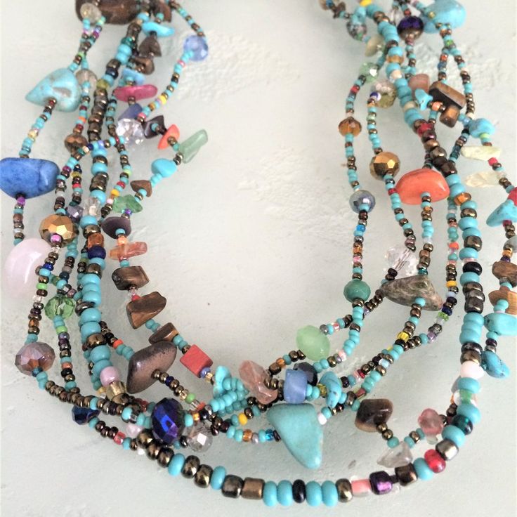 Artisan Czech Glass Bead 6 Strand 18" Long Fashion Statement Necklace Turquoise, Multi-Colors A Total Length Of 18" Long, With Glass Beads & Semi Precious Stone Chips. Easy To Open/Close Magnetic Clasp. One Of A Kind Necklace Handcrafted/No Two Are Exactly Alike Czech Glass Beads Are Know World Wide For Their Quality, Vibrant Colors Handmade In Guatemala Using Artisan Crafted Czech Glass Beads. Principles Of Fair Trade Are Upheld. Adjustable Multi-strand Turquoise Necklace With Colorful Beads, Multicolor Beaded Turquoise Necklace For Festivals, Adjustable Bohemian Turquoise Necklace With Colorful Beads, Turquoise Multi-strand Necklace For Festivals, Festival Turquoise Necklaces With Colorful Beads, Multicolor Large Beads Turquoise Necklace For Festivals, Artisan Turquoise Beaded Necklace For Festivals, Turquoise Multi-strand Beaded Necklace For Festivals, Multicolor Turquoise Necklace With Large Beads For Festivals