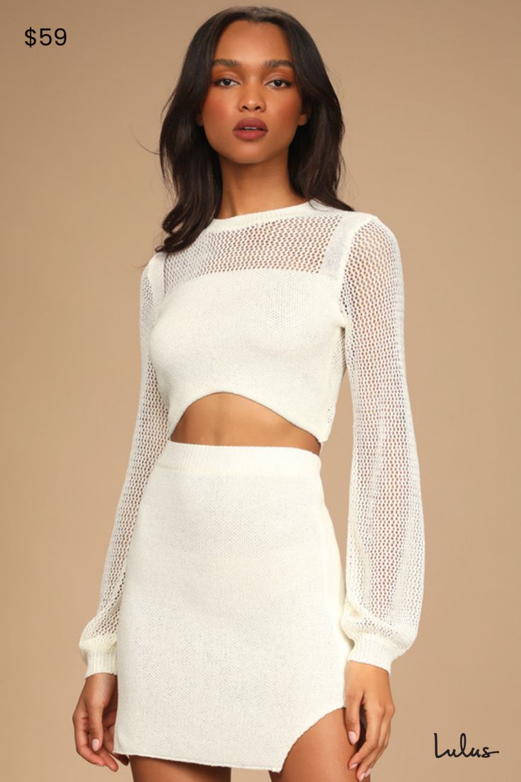 You and the Lulus Double the Delight Ivory Knit Two-Piece Mini Sweater Dress are sure to be the perfect pair! Lightweight knit, with loose knit detailing, shapes this two-piece sweater dress that has a crew neck top with sheer long sleeves and back and a slender strap at the cropped hem. The matching skirt has a high elasticized waist and an A-line silhouette with a side notch. Fit: This garment fits true to size. Length: Mid-thigh. Size medium Bust: Great for any cup size. Waist: Fitted - elastic waist allows stretch. Hip: Fitted - stretchy fabric allows room for hips. Undergarments: May be worn with an adhesive bra, petals, or no bra. Fabric: Fabric is very stretchy. Unlined. 100% Acrylic. Hand Wash Cold. With Like Colors Separately. Do Not Bleach. Line Dry. Iron Low Heat. Imported. Lulu White Textured Knit Fitted Dress, Beige Crew Neck Sweater Dress For Spring, White Fitted Knit Sweater Dress, Fitted White Knit Sweater Dress, White Fitted Sweater Dress For Spring, Chic Soft Knit Sweater Dress For Spring, White Knit Sweater Dress For Spring, White Textured Knit Fitted Sweater Dress, Spring Party Knitted Sweater