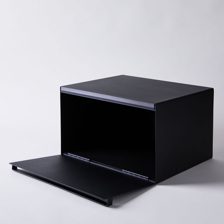 an open black box sitting on top of a white table