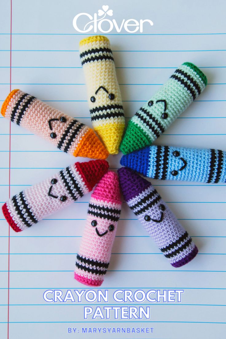 crocheted crayon crochet pencils arranged in the shape of smiley faces