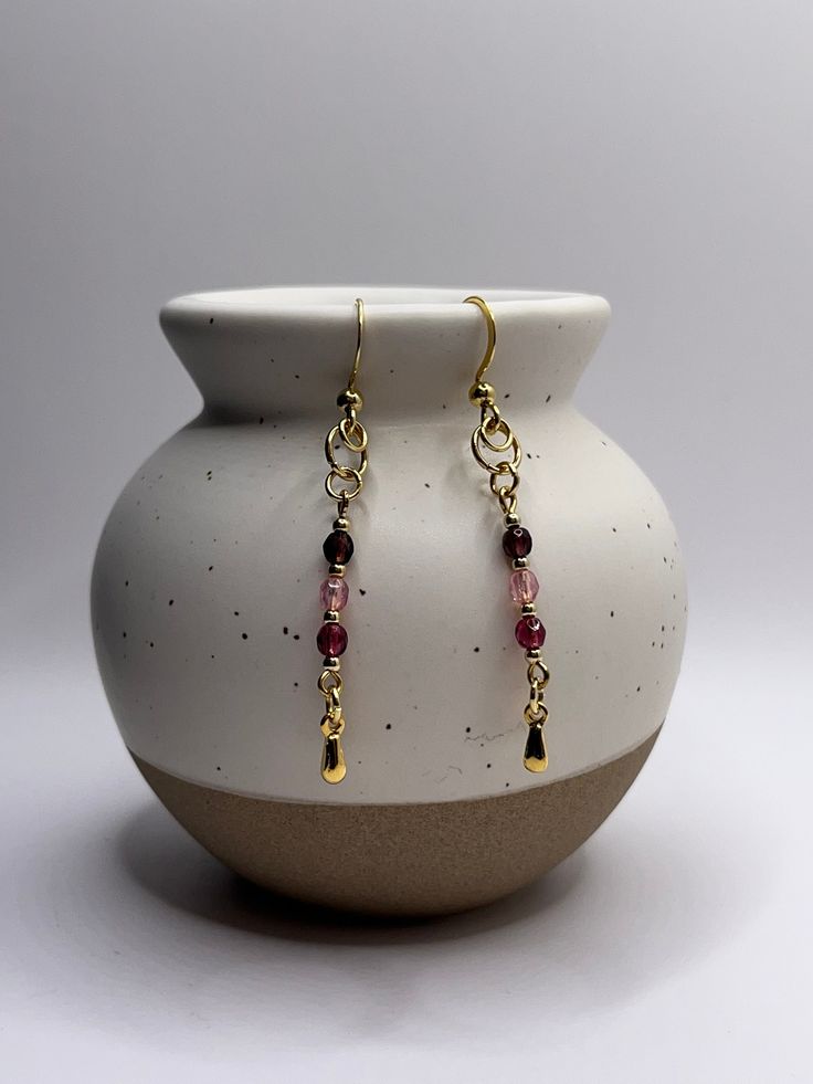 These purple and pink Czech glass bead earrings are dainty, colorful, and cute! I have recently begun incorporating gold plated stainless steel earrings into my shop, and they remain hypoallergenic and non-tarnishing! The stainless steel structure adds durability and functionality to this pair. While you don't need to tiptoe around the care of these earrings (a little water won't hurt them), please still treat them with care. Drop Length: 1.9 in. Materials: - Gold plated stainless steel - Czech glass beads Care: wipe gently with a cloth. Thank you for viewing my listing, and feel free to message me with any questions!  View more listings here: https://katescuriositiesco.etsy.com Glass Bead Earrings, Earrings Purple, Steel Earrings, Steel Structure, Stainless Steel Earrings, Bead Earrings, Czech Glass Beads, Glass Bead, Favorite Things Gift