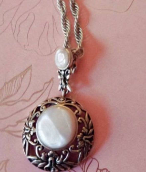 "Estate Pink Mother of Pearl Art Nouveau Pendant on a 24\" Sterling Silver Necklace. This Vintage Floral Piece features a secure snap closure on the Pendant (see photo 5) making it easier to remove from the chain. ESTATE SALE PIECES GEMOLOGIST CERTIFIED" White Round Pearl Necklace, White Pearl Necklace With Intricate Design As Gift, Silver Locket Necklace For Celebration, Elegant Round Metal Bridal Necklace, Ornate Pearl Pendant Jewelry For Formal Occasions, Ornate Jewelry With Large Pendant For Formal Occasions, Victorian Wedding Necklace With Large Pendant, Victorian Large Pendant Necklace For Weddings, Victorian Large Pendant Jewelry For Weddings