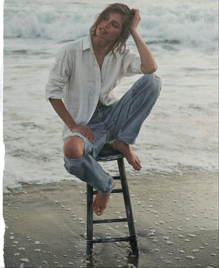 Jeans In Water Photoshoot, Blue Jeans White Shirt Aesthetic, White Shirt Beach Photoshoot, Beach Clothes Photoshoot, Beach Stool Photoshoot, Jeans On The Beach Photoshoot, Oversized Shirt Photoshoot Ideas, Denim Beach Photoshoot, Jean Beach Photoshoot