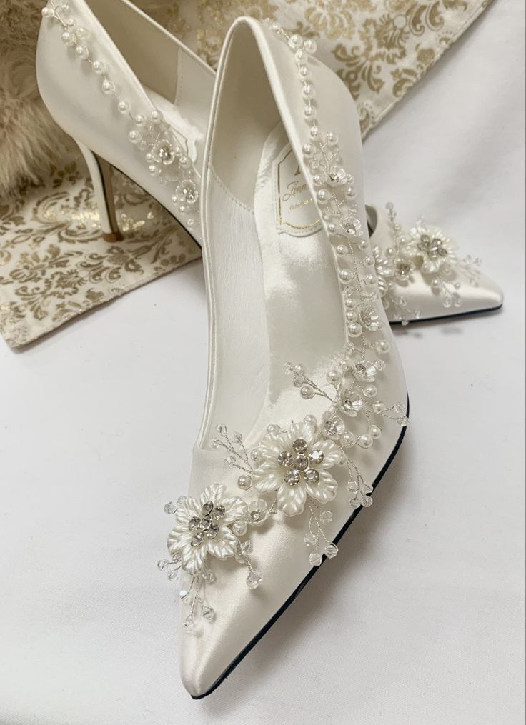 Simply Beautiful Hand Finished Daisy Chain Embellished Satin Bridal Shoes Satin Bridal Shoes Beautifully Hand Finished with Silver Diamante Flowers with Pearl Very Elegant Perfect Wedding Day Shoe High for Elegance Perfect for Comfort Sizes: UK 3-7 (EU 36-41) Beautifully Presented with Tissue Wrap Beautiful Wedding Shoes Brides Heels, Wedding Footwear For Bride, Embellished Pointed Toe Wedding Shoes, Diy Wedding Heels, Wedding Dais, Posh Shoes, Silver Bridal Shoes, Elegant Shoes Heels, Flower Wedding Shoes