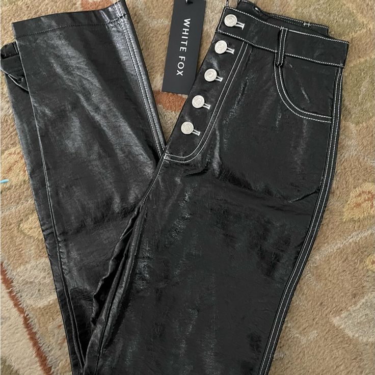 New With Tag Black Vegan Leather (Pu) High Waisted Button Front Pants From White Fox Boutique, Size S, Waist 26”, Hip 17” Across, Inseam 31” Chic Button-up Party Bottoms, High Rise Bottoms With Button Closure For Night Out, High Waist Bottoms With Button Closure For Night Out, High Rise Button Closure Night Out Bottoms, High Rise Button Closure Bottoms For Night Out, High-waist Bottoms With Button Closure For Night Out, Black Pants With Button Zip Fly For Work, Black Bottoms With Button Zip Fly For Work, Black Button Zip Fly Bottoms For Work