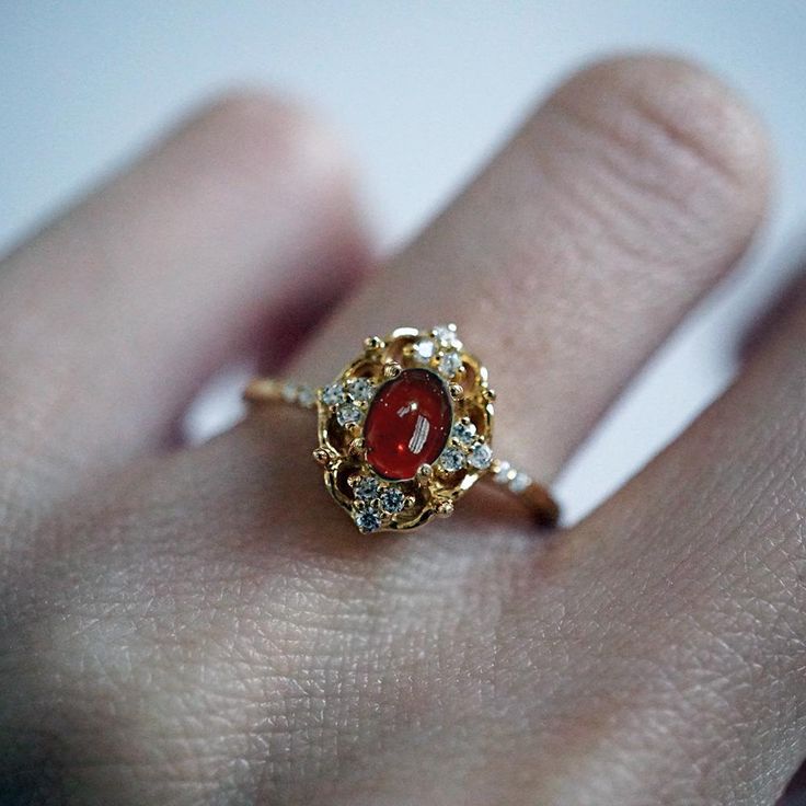 Gold Garnet Birthstone Ring, Exquisite Red Ring With Rose Cut Diamonds, Gold Heirloom Ruby Ring With Gemstone Accents, Heirloom Gold Ruby Ring With Gemstone Accents, Heirloom Gold Garnet Rings, Vintage Gold Garnet Birthstone Ring, Spiritual Ruby Rings In Red, Exquisite Gold Ruby Gemstone Ring, Red Heirloom Jewelry With Gemstone Accents