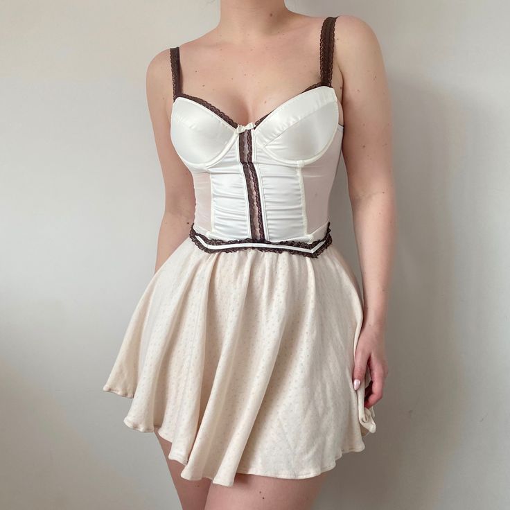 Size: EU size 75C with sister sizes 70D and 80B US/UK 34C with sister sizes 32D and 36B  Color: White Condition: Perfect vintage condition Casual Fitted Corset With Built-in Bra, Beige Sleeveless Corset With Built-in Bra, Fitted Cream Top With Boned Bodice, Fitted Sleeveless Beige Corset, Chic Fitted Beige Corset, Beige Fitted Sleeveless Corset, Beige Fitted Chic Corset, Fitted Beige Top With Boned Bodice, Beige Fitted Corset With Built-in Bra