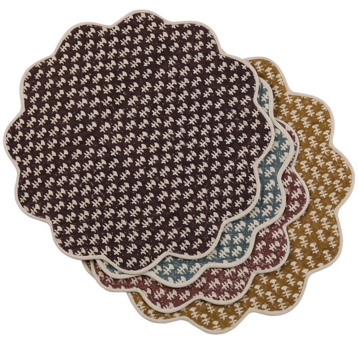 three placemats with different patterns on each one and the same pattern on the other