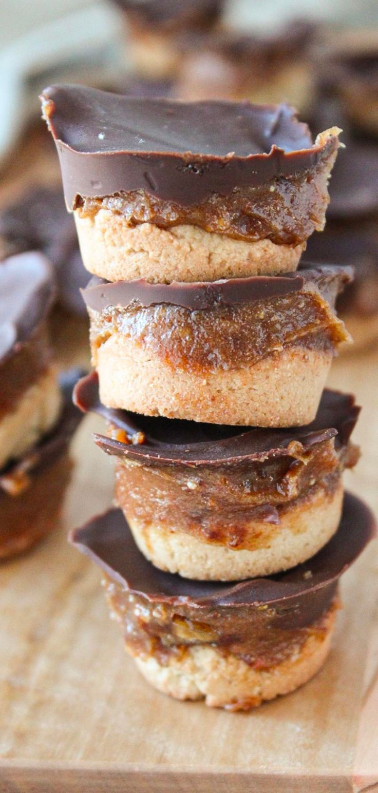 chocolate covered donuts stacked on top of each other