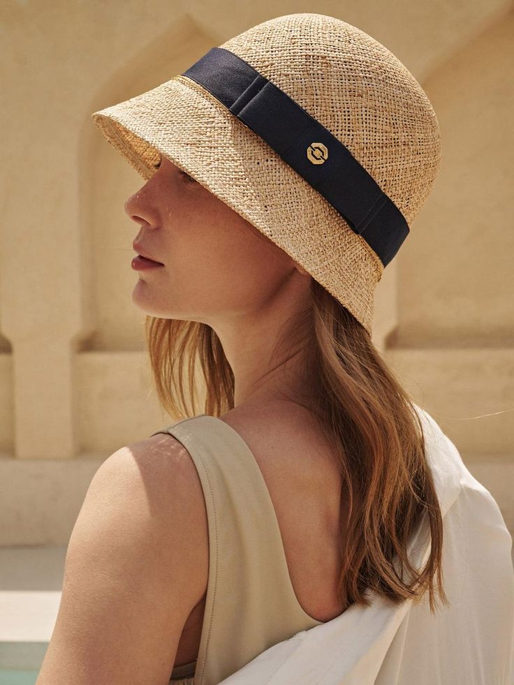 Saint Luxu is a high-end scarf accessory brand, and they are concerned about expressing women's hidden desires in a mature way.- Great to block UV light- Lightweight and comfortable to wear- Raffia sun visor with a natural tanning- Luxurious embossing texture detail- Features a great breathability Chic Visor Sun Hat For Travel, Navy Visor Hat For Summer, Chic Travel Visor Hat, Luxury Travel Visor Hat, Luxury Summer Bucket Hat, Navy Hat For Spring, Luxury Adjustable Sun Hat For Vacation, Elegant Bucket Hat For Travel, Navy Beach Hat