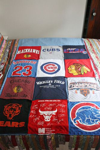 a chicago bears quilt on a bed in a bedroom