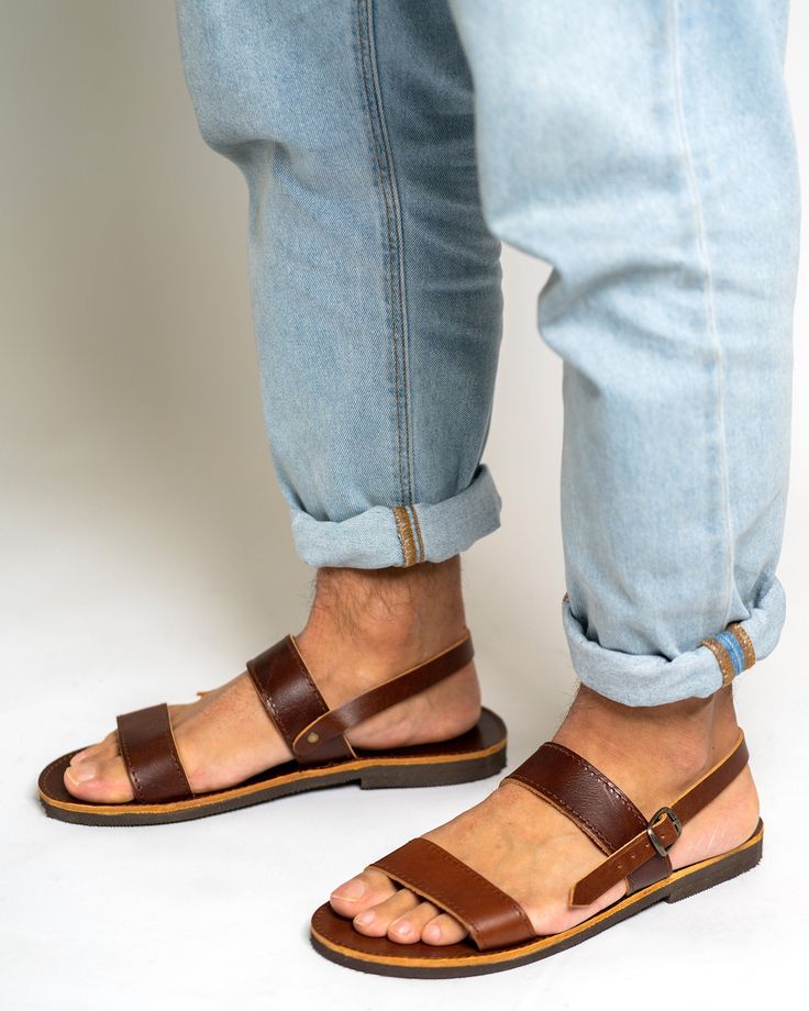 Step out in style with these Greek handmade men's leather sandals. Crafted from high-quality vegetable-tanned calf leather, these brown slingback sandals offer both comfort and sophistication. Perfect for any occasion, these sandals exude timeless charm and are a must-have addition to your footwear collection. All of our products are handmade with the best and highest quality leather from our beloved island of ''Crete''.  The leather used for each item may be irregular in terms of colour and texture due to its natural characteristics. SIZE GUIDE All genuine leather sandals can be stiff at the begging and widen after few days of wearing them.  If you wear a half size, choose the nearest whole size UP Sizes available:  EU40   414243 44   45     46    47 US 7  8 910  11   12      13     14 CA Summer Sandals With Leather Lining And Vegetable Tanned Leather, Summer Leather Sandals With Single Toe Strap, Summer Vegetable Tanned Leather Open Toe Sandals, Summer Sandals With Rubber Sole In Vegetable Tanned Leather, Summer Vegetable-tanned Sandals With Single Toe Strap, Leather Sandals Men, Sandals Greek, Mens Shoes Sandals, Mens Leather Sandals