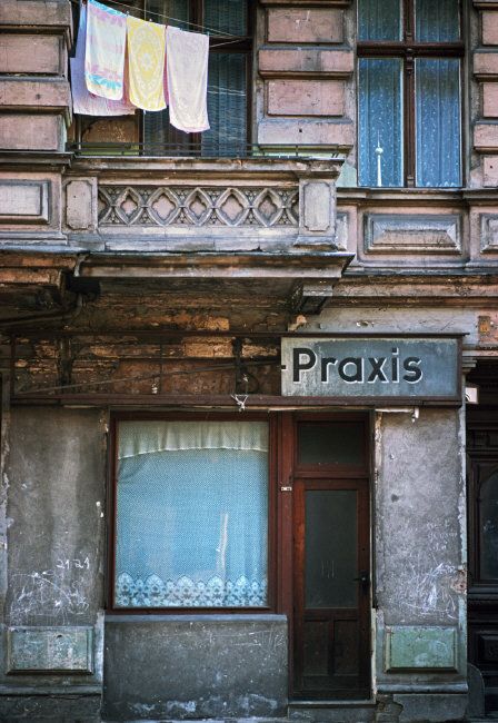 an old building with clothes hanging out to dry