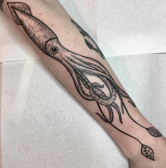 an octopus tattoo on the arm