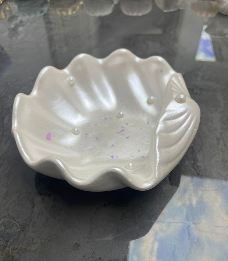 a white bowl sitting on top of a table