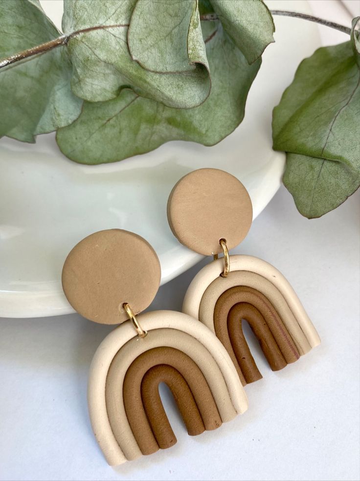 the wooden earrings are made with wood and have two circles on each earring, one in