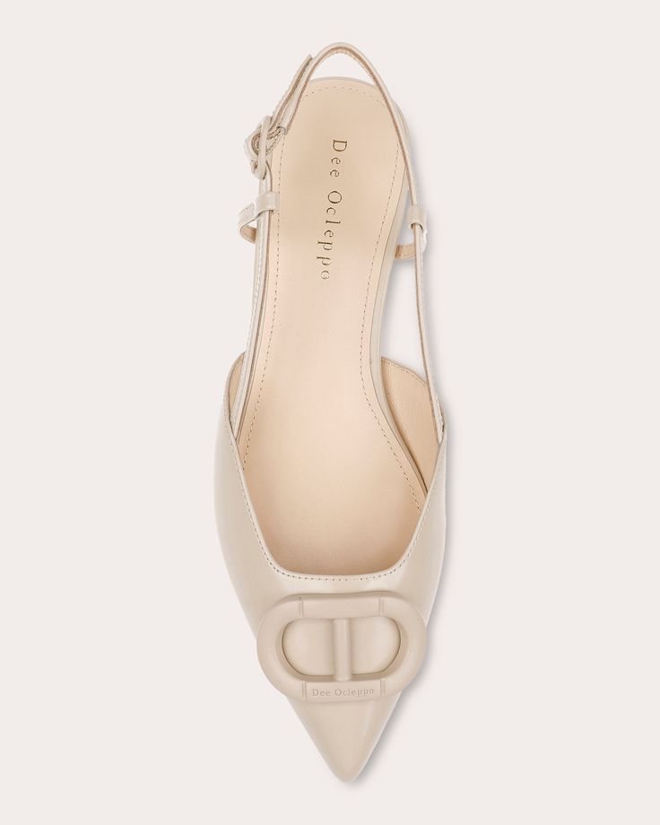 The epitome of refined sophistication, the Rome flat crafts its slingback silhouette from genuine leather. The pointed toe is topped with a tonal logo detail to reflect Dee Ocleppo's signature aesthetic. Buckle closure Slingback strap Pointed toe Signature logo embellishment Upper: 100% leather Lining: 100% leather Outsole: 100% leather Spot clean Made in China Size & Fit Fits true to size Elegant Beige Flat Slingback Pumps, Beige Flat Slingback Pumps For Formal Occasions, Classic Leather Slingback Pumps With Single Toe Strap, Elegant Flat Slingback Pumps With Leather Sole, Luxury Flat Heel Slingback Pumps With Strap, Elegant Flat Leather Slingback Sandals, Leather Lined Flat Heel Slingback Pumps, Classic Calf Leather Slingback Pumps, Elegant Flat Slingback Pumps With Heel Strap