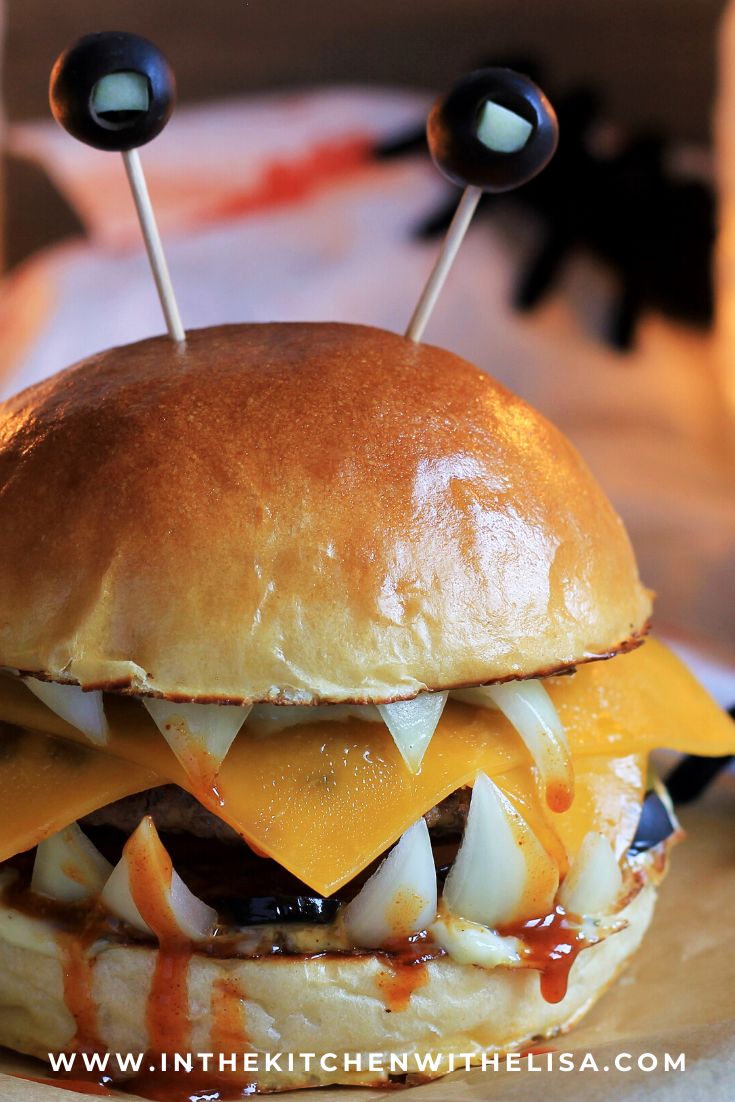 a cheeseburger with googly eyes on it