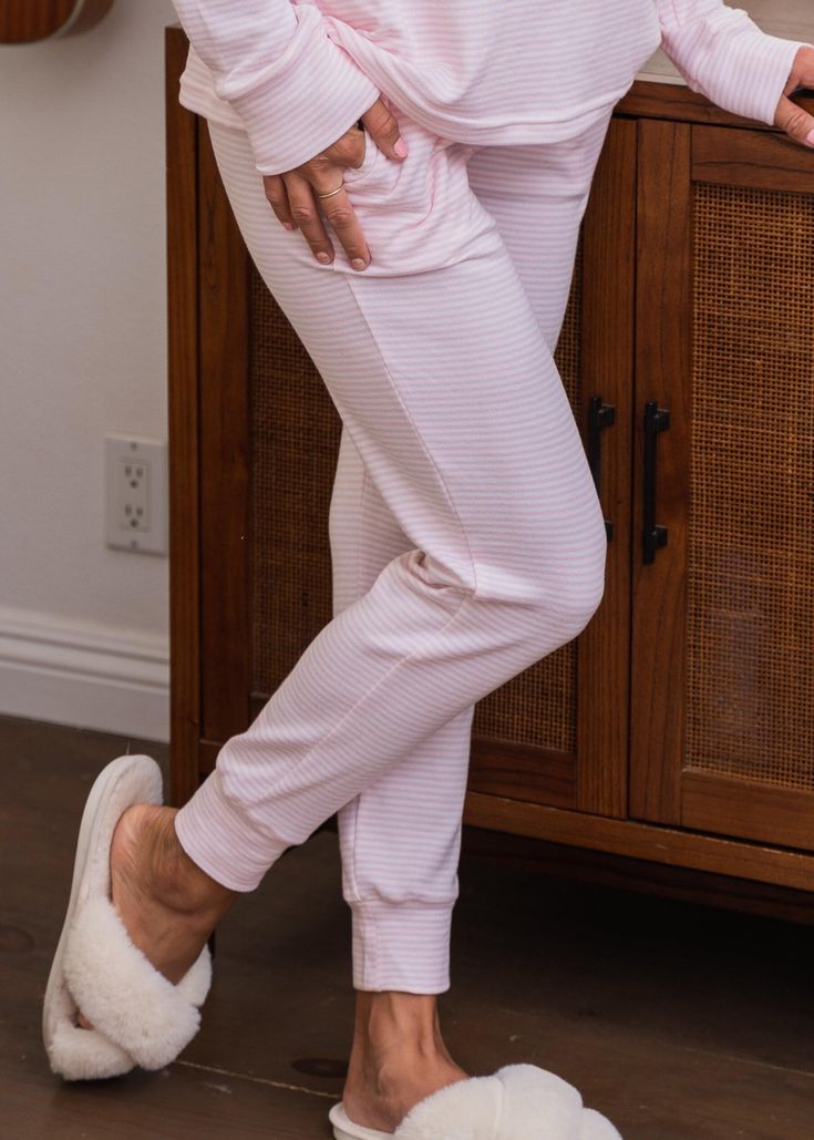 Extra Soft Lounge PantsFeatures Super soft fabric Elasticized waist with drawcord ties. Banded cuffs. Care Machine wash on gentle cycle Lay flat to dry in the shade Material 95% Polyester 5% Spandex Comfortable Pink Loungewear Pants, Comfortable Pink Pants For Loungewear, Comfy Joggers For Relaxation, Pink Sweatpants With Ribbed Waistband, Comfy Pink Bottoms For Loungewear, Comfy Drawstring Joggers For Lounging, Comfortable Pink Lounging Pants, Comfy Joggers With Drawstring For Lounging, Comfortable Joggers For Relaxation