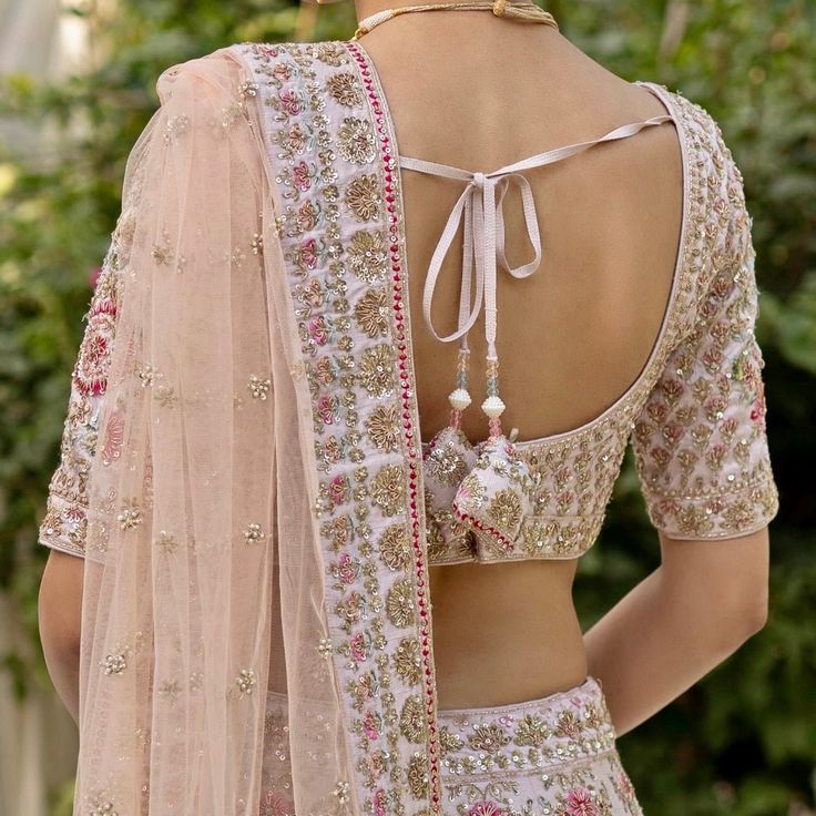 Featuring a peach raw silk lehenga set embroidered with embroidered with traditional zardozi using 12 vibrant silken threads, cutdana, sequins and dabka. Teamed with an zardosi blouse with floral detail on sleeves and a matching blush pink dupatta. An additional embroidered blush dupatta completes the bridal look. Composition: Lehenga and Blouse - Raw Silk, Dupatta- Net Care: Dry Clean Only and Vacuum Storage This product can be customised for colour, sleeves, length of blouse and neck design Delivery : 8-10 weeks as the product is hand crafted. For more information and sizes please contact fabiliciousfashion@gmail.com or visit our Copenhagen studio.About the Designer : Angad Singh's journey in the world of fashion started with at an early age as he grew up in a family business that was im Double Dupatta Bridal Lehenga, Double Dupatta Lehenga, Zardosi Blouse, Double Dupatta, Dupatta Bridal, Lehenga And Blouse, Pink Dupatta, Raw Silk Lehenga, Vacuum Storage