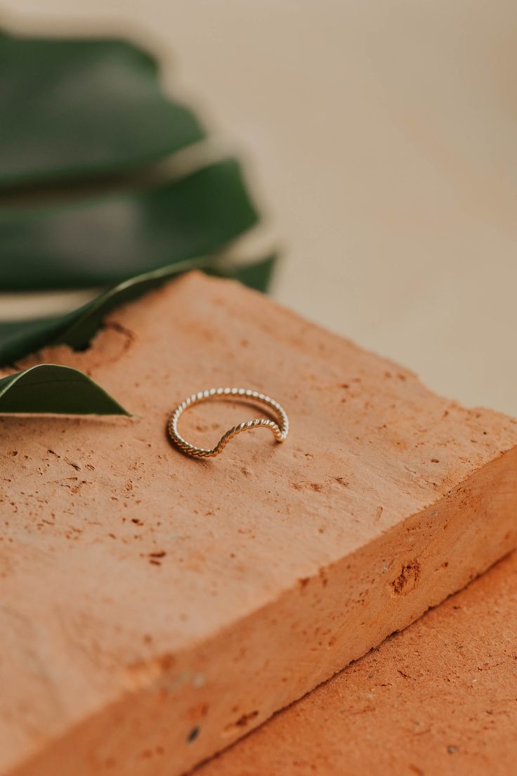 Originally designed to be paired with one of our Gemstone Rings, our Dune Ring stacks beautifully with any Stacking Bands and can hold it's own as a solo ring, too. Twisted wire is hand-shaped and made into a unique stacking ring. Available in 14kt Gold Fill + Sterling Silver. Handmade in Eau Claire, WI. Our jewelry is handmade so each piece will be unique and may vary slightly from what is pictured. Ring Stacks, Backdrops Necklace, Second Piercing, Zodiac Rings, Ear Party, Hoop Charms, Stacking Bands, Twisted Wire, Fall Is Here