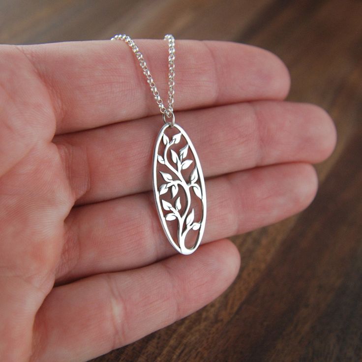 Oval sterling silver tree of life pendant necklace, oval pendant, tree necklace, family tree, silver tree pendant, nature, tree jewelry A beautiful oval shaped sterling silver tree of life pendant is suspended from a sterling silver rolo chain that can be up to 22 inches in length and is secured with a sterling silver clasp. The pendant measures 1.38 x 0.47 inches (35 x 12mm). Your purchase will arrive in a jewelry box ready for gift giving or as a gift for yourself! Enter my shop here: jersey60 Tree Jewelry, Tree Of Life Jewelry, Metal Clay Jewelry, Filigree Jewelry, Art Jewelry Contemporary, Silver Jewelry Design, Tree Necklace, Silver Tree, Nature Tree