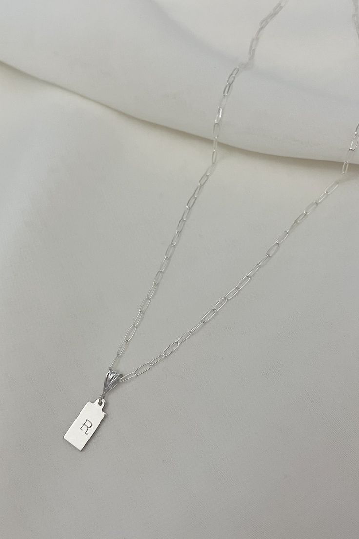 All initial necklace are buy one get one 30% off. Use code Thankyou30 Whether you choose your own initial or one of some one you love our dainty initial necklace is a subtle yet charming piece that effortlessly complements any style. Delicately crafted with a petite tag pendant showcasing your chosen initial, it adds a touch of personalized elegance. The lightweight design and 14k gold filled fine chain make it perfect for everyday wear, it is a versatile addition to any jewelry collection. 14mm Initial Necklace Silver, Dainty Initial Necklace, Buy One Get One, Necklace Silver, Initial Necklace, Ring Bracelet, You Choose, Get One, Silver Necklaces