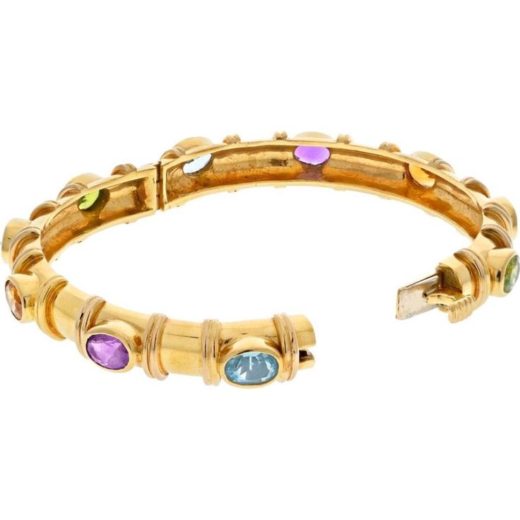 Engage with the symphony of style and sophistication in David Webb's 18K Yellow Gold Semi Precious Color Stone Bangle Bracelet! Elevate your accessory game with this stunning bangle bracelet, a testament to timeless elegance and vibrant charm. Crafted in luxurious 18K yellow gold, this piece exudes a radiant glow, complemented by nine oval-cut multi-colored gemstones including topaz, amethyst, and citrine.Designed with a hinged lock for effortless wear, this bangle seamlessly combines modern fla Elegant Multi-stone Bangle Bracelets, Luxury Multi-stone Cuff Bracelet Bangle, Formal Multi-stone Bangle, Elegant Multi-stone Cuff Bangle Bracelet, Elegant Multi-stone Bangle, Modern Gold Bracelet With Multi-stone, Gemstone Bangle Bracelets, Amethyst Bangle, Amethyst And Citrine