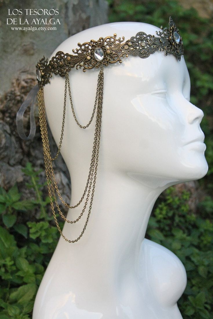 renaissance crown over brass base can be adjust on the back with a ribbon Find the amazing dress on Elficwear shop https://www.etsy.com/es/listing/268039928/elven-princess-dress?ref=shop_home_active_16 Photo : https://www.facebook.com/EleanArt/?fref=ts ABOUT SHIPPING ⋆ All our items are made to order ,normally we ship in about 4-10 days after we recieve the payment , if for some reason we would need more extra time we will inform you by conversation . All our pieces are nicely and security packe Ceremonial Gold Crown With Structured Shape, Gold Ceremonial Crown With Structured Shape, Elegant Ceremonial Crown Headpieces, Gold Ceremonial Headpiece With Tall Crown, Gold Crown Design Headpiece With Pinched Crown, Gold Ceremonial Headpiece With Round Crown, Bohemian Round Crown Headpiece For Wedding, Gold Structured Crown Headpiece For Festival, Gold Regal Headpiece With Tall Crown