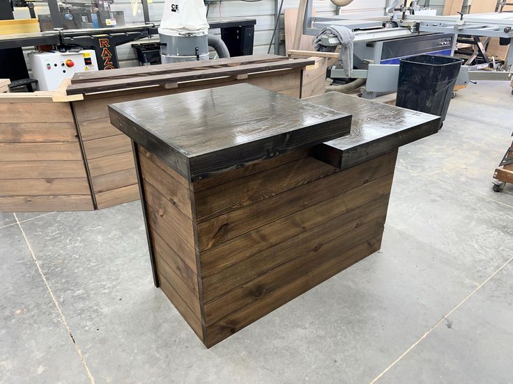 a workbench in a shop with lots of woodworking tools and other items