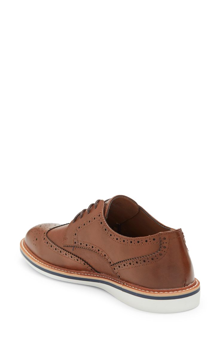 Broguing and pinking details shape a wingtip derby that is crafted with a mixed-material finish and comfortable OrthoLite® footbed. Lace-up OrthoLite® footbed Manmade upper and sole Imported Wingtip Oxford Lace-up Shoes With Textured Sole, Textured Sole Wingtip Oxfords, Brown Low-top Oxfords With Brogue Detailing, Brown Low-top Brogue Oxfords, Wingtip Oxfords With Textured Sole, Low-top Oxfords With Brogue Detailing, Brown Oxfords With Cushioned Footbed And Round Toe, Brown Oxfords With Cushioned Footbed, Brown Oxfords With Perforated Toe Box