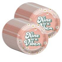 two pink paper plates that say nine is a vibe on the front and one has daisies