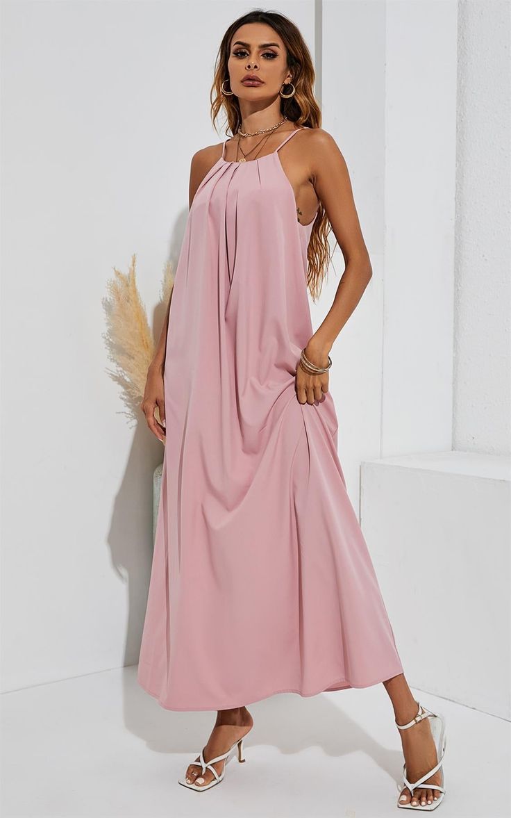 Cold Shoulder Maxi Dress In pink Our pink maxi dress is classy and elegant; falling graciously as you move. Perfect for a wedding or any other event. Pair it with your favourite heels and clutch bag to complete the look. - Cold shoulder- Bridesmaids dress- Occasion wear dress.- Perfect for a beach wedding or a special occasion Model is 5FT 8INCH and wears size 8 Designed for a relaxed fit Fits large to size, take one size smaller than normal S-94cm(bust)M-98cmL-102CML-106CM 100% Polyester Pink Sleeveless Maxi Dress For Wedding Guest, Elegant Pink Maxi Dress For Prom, Elegant Pink Prom Maxi Dress, Pink Summer Maxi Dress For Wedding Guest, Pink Feminine Maxi Dress For Prom Season, Feminine Pink Maxi Dress For Prom Season, Chic Pink Maxi Dress For Evening, Chic Pink Maxi Evening Dress, Pink Maxi Length Evening Dress For Wedding Guest